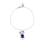 Silver bracelet with a Sapphire heart-shaped Koala charm on a white background