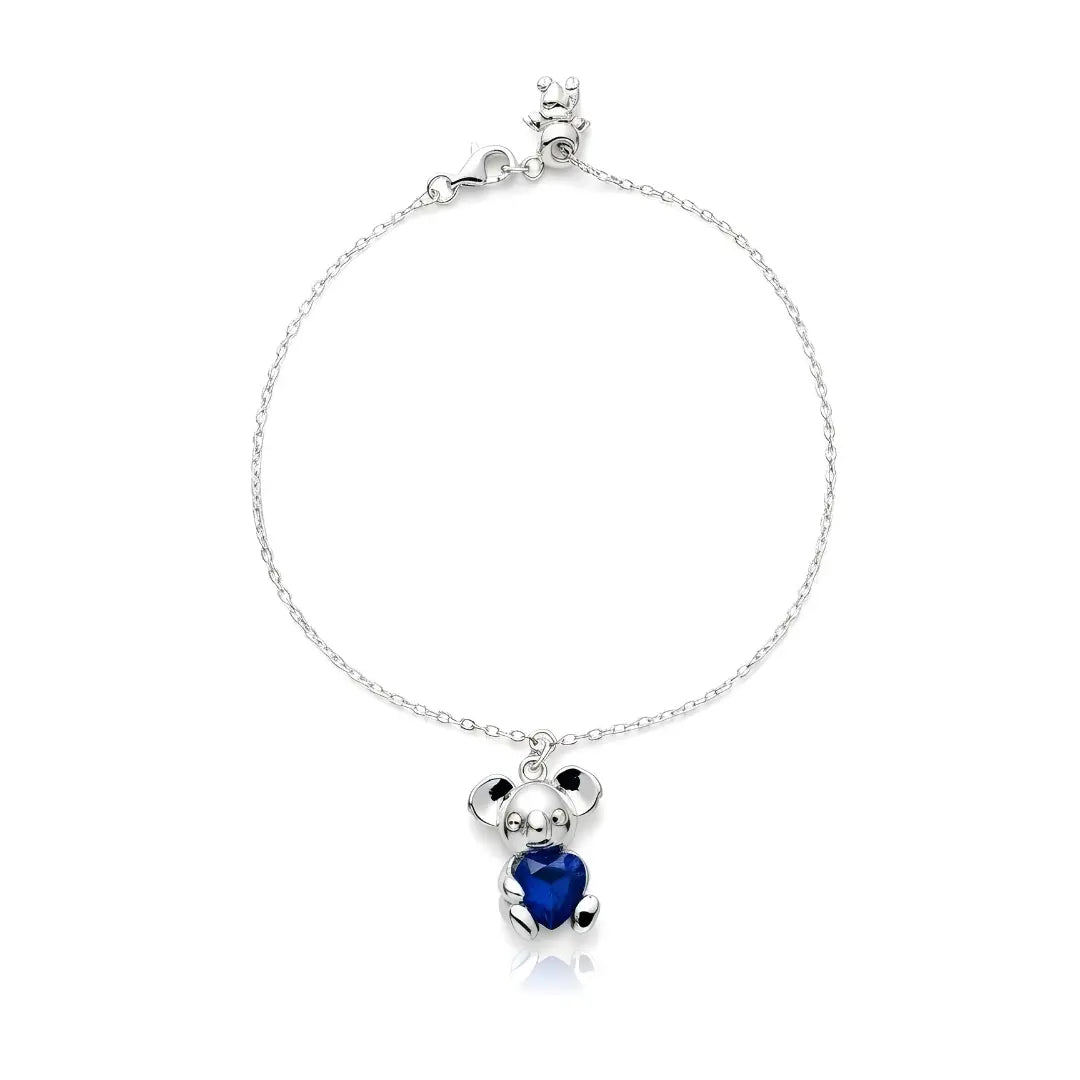 Silver bracelet with a Sapphire heart-shaped Koala charm on a white background