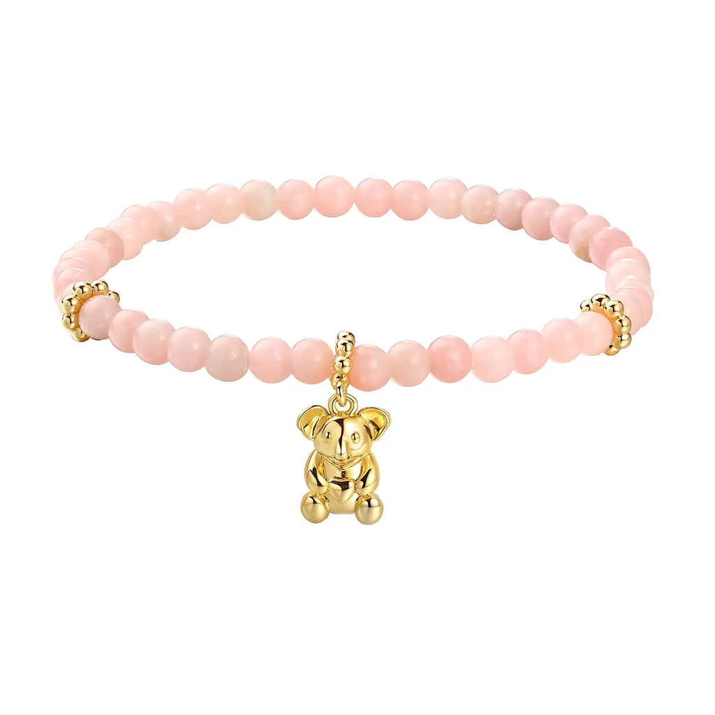 A bracelet made of rose quartz beads with a gold-plated koala charm.