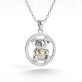 Silver Koala pendant with a 10k gold heart circle cz on a white background