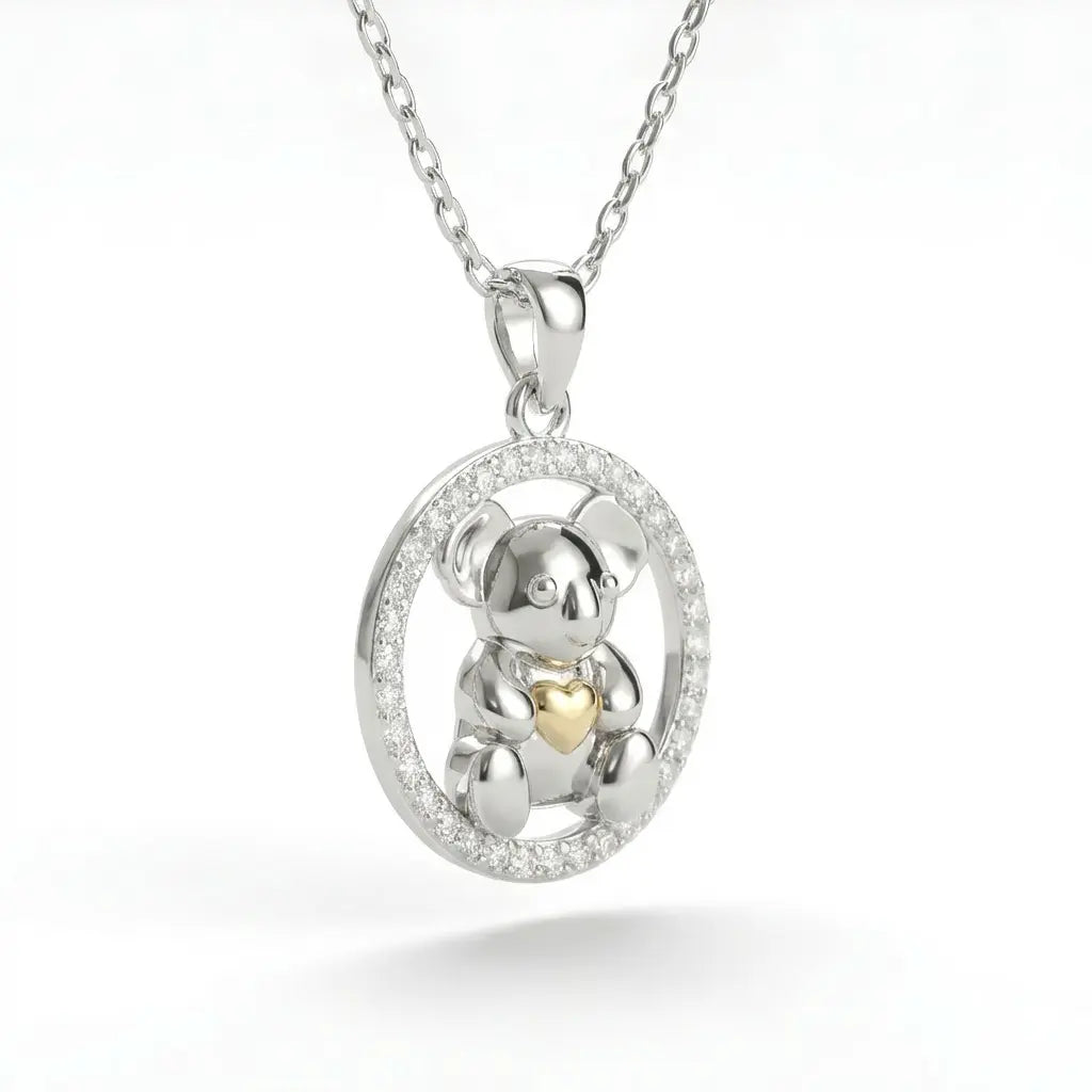 Silver pendant with a Koala and 10k gold heart cz circle on a white background